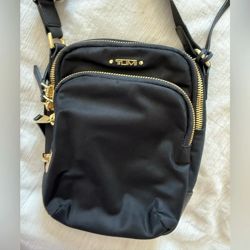 Tumi Black Crossbody Bag with Gold Accents - Picture 1 of 2